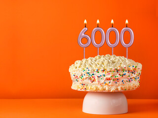 Candle number 6000 - Number of followers or likes.