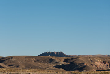 Beautiful Andean landscape with clouds and a blue sky illuminated with natural light in the...