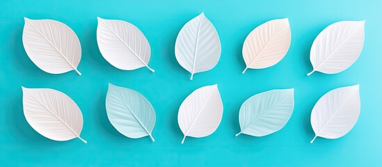 Pastel Leaves Arranged On A Blue Background