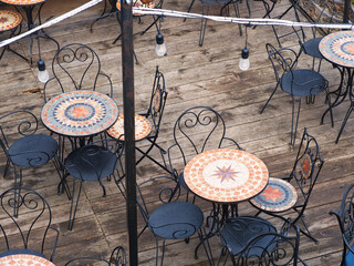 Outdoor cafe tables on wooden deck
