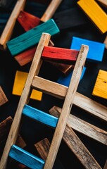 Ladders adorning the wall to signify success and growth, assembled from wooden blocks