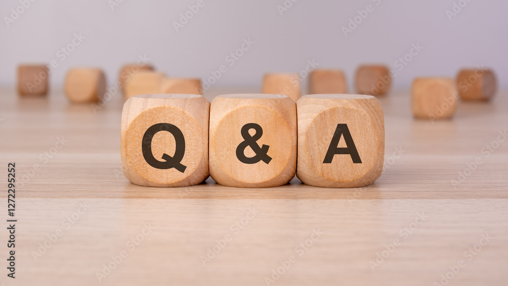 Poster three wooden blocks with q and a symbolizing communication, discussion, problem-solving, and knowled