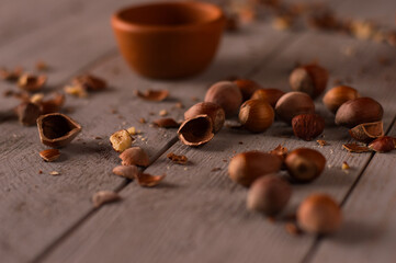 Hazelnuts and shells on the table. Healthy vegan food, nuts. Hazelnut shells.