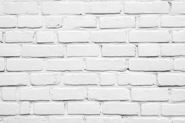 White brick wall with a few bricks missing