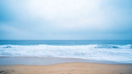 Fototapeta premium Serene Ocean Waves Crashing on Sandy Beach