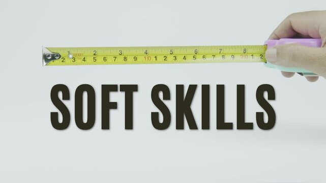 "Soft Skills" text with a yellow tape measure on a white background, symbolizing precision, accuracy, and competency evaluation in a clean, minimal video