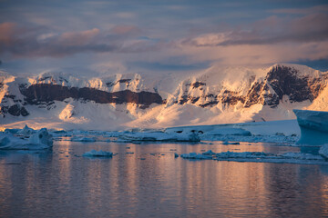 Antarctic Peninsula sunset, ice floes.