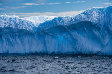 Antarctic Peninsula iceberg, dramatic icy landscape.