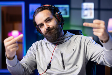 Portrait of gamer feeling frustrated after losing against opponent in online esports match, doing...
