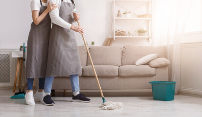 Sharing Household Duties. Unrecognizable Couple Cleaning Floor Together, Tidying Flat, Cropped...