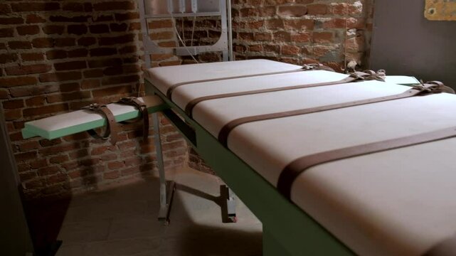 Lethal injection concept. Panoramic over the bed for prisoners