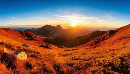 Fototapeta premium sunset in the mountains with blue sky 