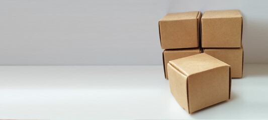 Packaging process cardboard boxes stacked on table product display minimalist environment top view commerce concept