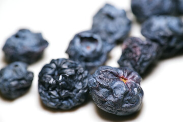 wrinkled and shriveled blueberry in the fridge