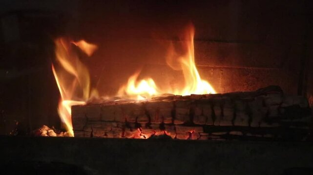 Fireplace lit with crackling fire noise