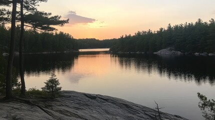 Fototapeta premium Serene Sunset Over Calm Lake And Forest Trees