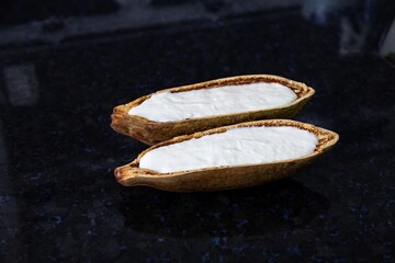 Traditional cupuaçu cream, cupuaçu mousse served in the fruit shell with grated chocolate