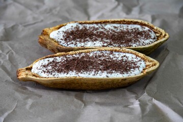 Traditional cupuaçu cream, cupuaçu mousse served in the fruit shell with grated chocolate