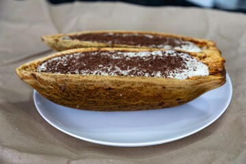 Traditional cupuaçu cream, cupuaçu mousse served in the fruit shell with grated chocolate