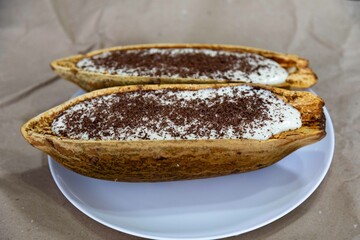 Traditional cupuaçu cream, cupuaçu mousse served in the fruit shell with grated chocolate