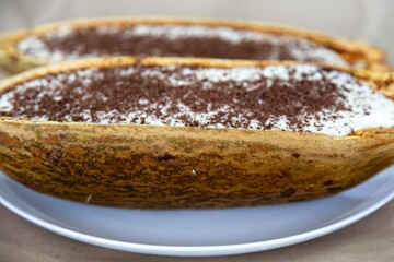 Traditional cupuaçu cream, cupuaçu mousse served in the fruit shell with grated chocolate