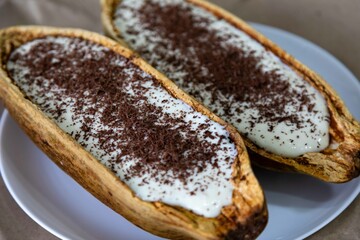 Traditional cupuaçu cream, cupuaçu mousse served in the fruit shell with grated chocolate