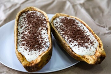Traditional cupuaçu cream, cupuaçu mousse served in the fruit shell with grated chocolate