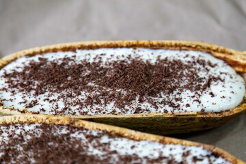 Traditional cupuaçu cream, cupuaçu mousse served in the fruit shell with grated chocolate