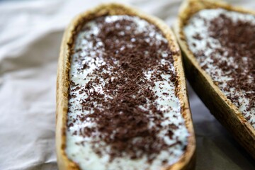 Traditional cupuaçu cream, cupuaçu mousse served in the fruit shell with grated chocolate