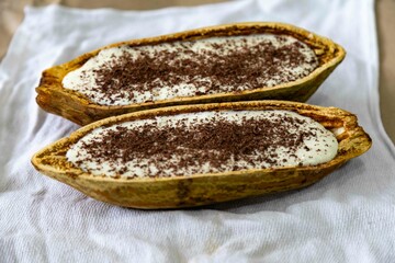 Traditional cupuaçu cream, cupuaçu mousse served in the fruit shell with grated chocolate