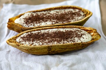 Traditional cupuaçu cream, cupuaçu mousse served in the fruit shell with grated chocolate