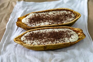 Traditional cupuaçu cream, cupuaçu mousse served in the fruit shell with grated chocolate