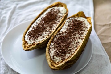 Traditional cupuaçu cream, cupuaçu mousse served in the fruit shell with grated chocolate