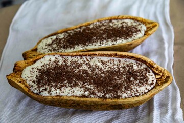 Traditional cupuaçu cream, cupuaçu mousse served in the fruit shell with grated chocolate