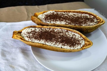 Traditional cupuaçu cream, cupuaçu mousse served in the fruit shell with grated chocolate