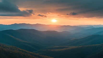 Fototapeta premium Breathtaking Sunset Over Mountain Range Showcases Vibrant Colors and Serene Landscape