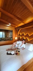 Handsome Man Enjoying Honeymoon with Afternoon Tea in a Cozy Bed