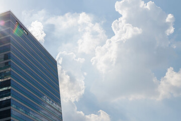 Glass office building with blue sky
