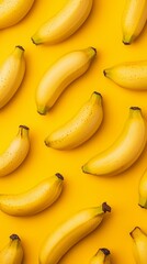 A vibrant arrangement of ripe bananas on a bright yellow background