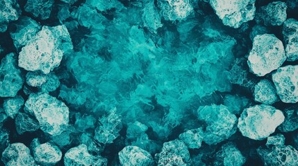 Aerial view of turquoise water surrounded by textured rocks, creating a serene atmosphere