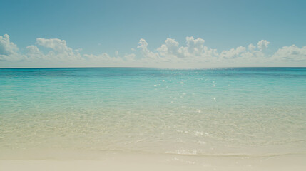 Obraz premium Tranquil Turquoise Beach with Sparkling Water and Fluffy Clouds Above the Horizon View Scenery.