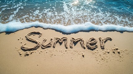 Fototapeta premium The word Summer written in the sand on a beach with gentle blue sea waves rolling in, symbolizing the peacefulness of vacation by the ocean. No people no text