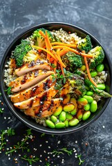 Quinoa bowl with grilled chicken and fresh vegetables ready to enjoy
