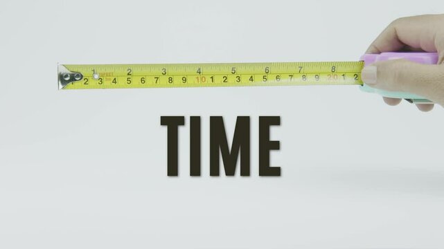 "Time" text with a yellow tape measure on a white background, symbolizing precision, accuracy, and measurement in a clean, minimal video