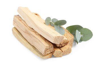 Palo santo sticks and eucalyptus leaves isolated on white