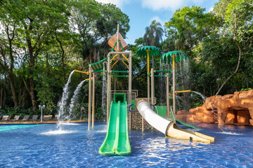 Children's Water Play Area in a Pool with Slides, Waterfalls, Fountains and Climbing Structure in a Tropical Location in Brazil