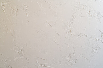 Minimalist taupe gray painted wall with textured finish, perfect for modern interiors. This clean surface adds touch of elegance to any space