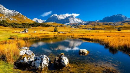 Serene landscape featuring a pristine alpine lake with a stunning reflection of the majestic snow capped mountains under a bright blue sky  A tranquil and captivating natural wonder