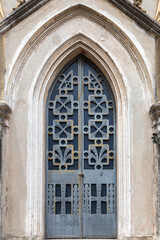 Double Blue Arched Metal Doors on a Mausoleum in a Cemetery in Buenos Aires, Argentina with Rust and a Rich Patina of Age