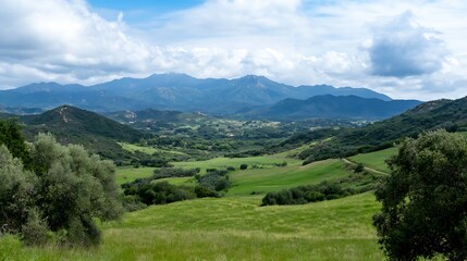 Obraz premium Breathtaking View of Verdant Green Fields and Rolling Mountains Under Bright Blue Sky : Generative AI